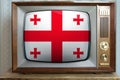 Old tube vintage tv with the national flag of georgia on the screen, the concept of eternal values Ã¢â¬â¹Ã¢â¬â¹on television, global